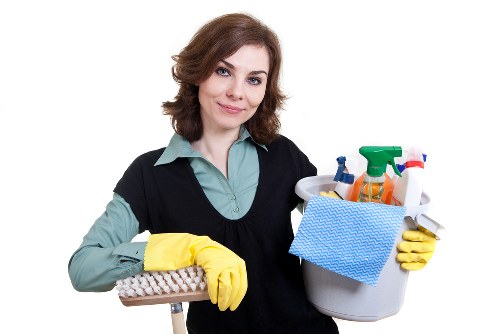 Technician wearing PPE during professional carpet cleaning in South Kensington